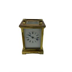 A compact late 19th century French carriage clock with a lever platform escapement, enamel dial with Roman numerals, minute markers and steel spade hands, four bevelled glass panels and a rectangular panel to the top of the case. No key. H10cm