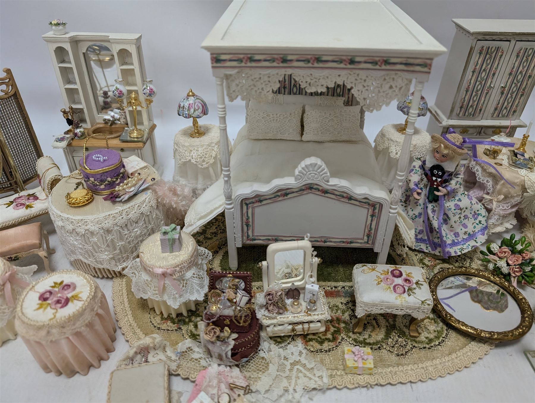 Dolls house bedroom and dressing room furniture, including beds, wardrobe, dressing table, lamps, tables, two figures and a collection of accessories