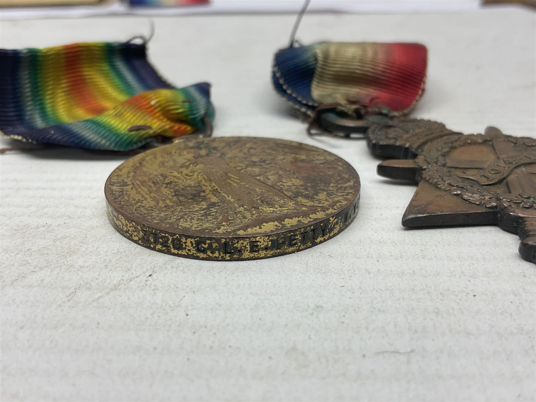 WWI pair of medals comprising British War Medal and Victory Medal awarded to 32682 Pte. W. Meadows W. Rid. R. in issue box; WWI pair of medals comprising 1914-15 Star and Victory Medal awarded to 3720 Pte. (later Cpl.) E. Petty W. York. R. with issue letter from Tank Corps; WWII group of five medals comprising 1939-45 War Medal, Defence Medal and 1939-45, Italy and Africa Stars; all with ribbons; and book of nineteen seaman's Certificates of Discharge to cook Charles Filburn 1893 - 1901 from various British ports