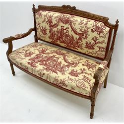 French style walnut framed two seat settee, shaped cresting rail, acanthus carved arms, turned tapering fluted supports, upholstered in a toile de jouy fabric