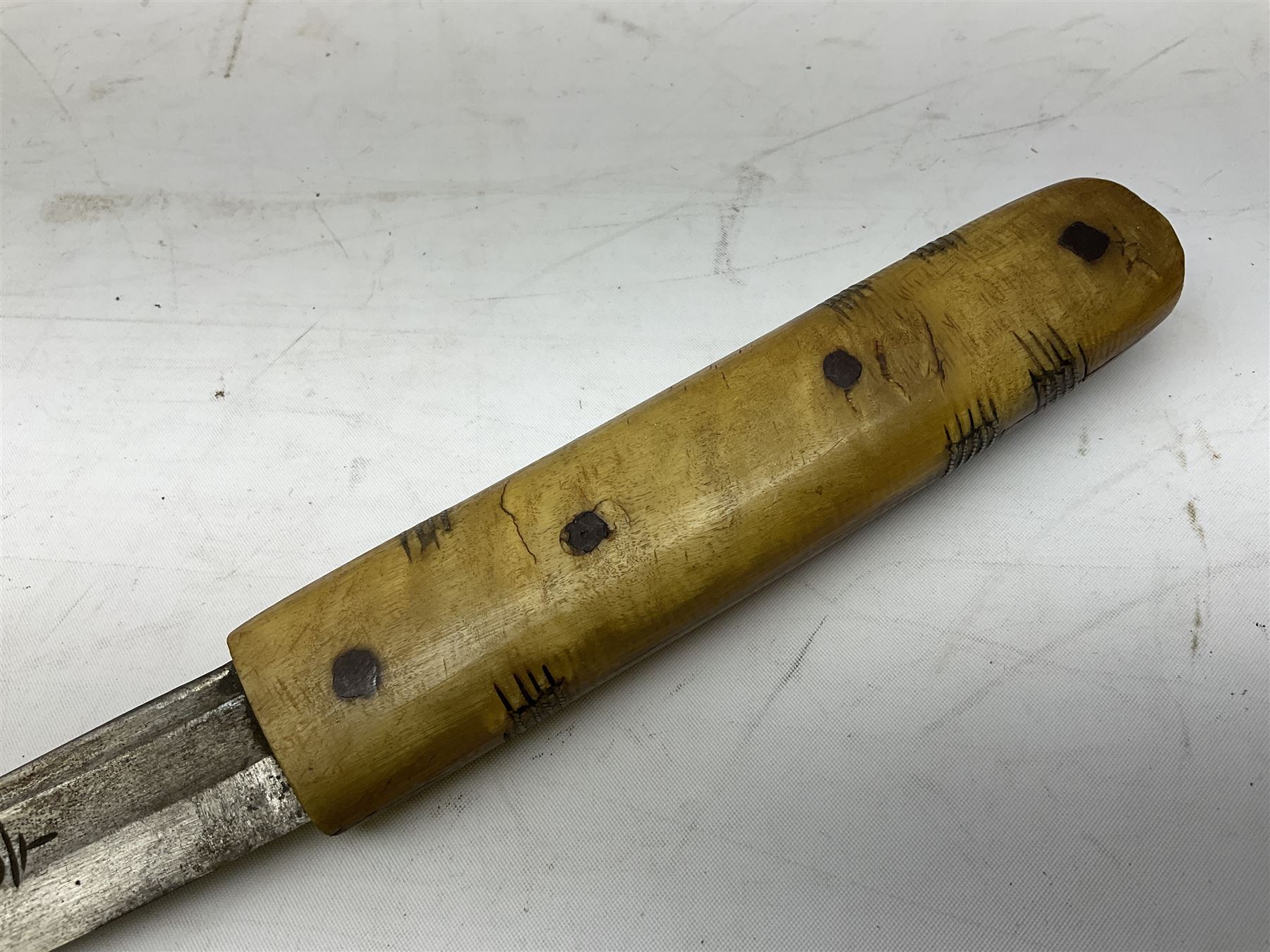 Near pair of African Moroccan Berber tribal Shula daggers each with engraved 39cm curving fullered steel blade, carved and inlaid horn grip and leather covered scabbard L57cm overall; kindjal style dagger with brass covered and jewelled grip and scabbard; another Eastern dagger with leather covered grip and scabbard; and a large Eastern knife with animal hide scabbard (5)