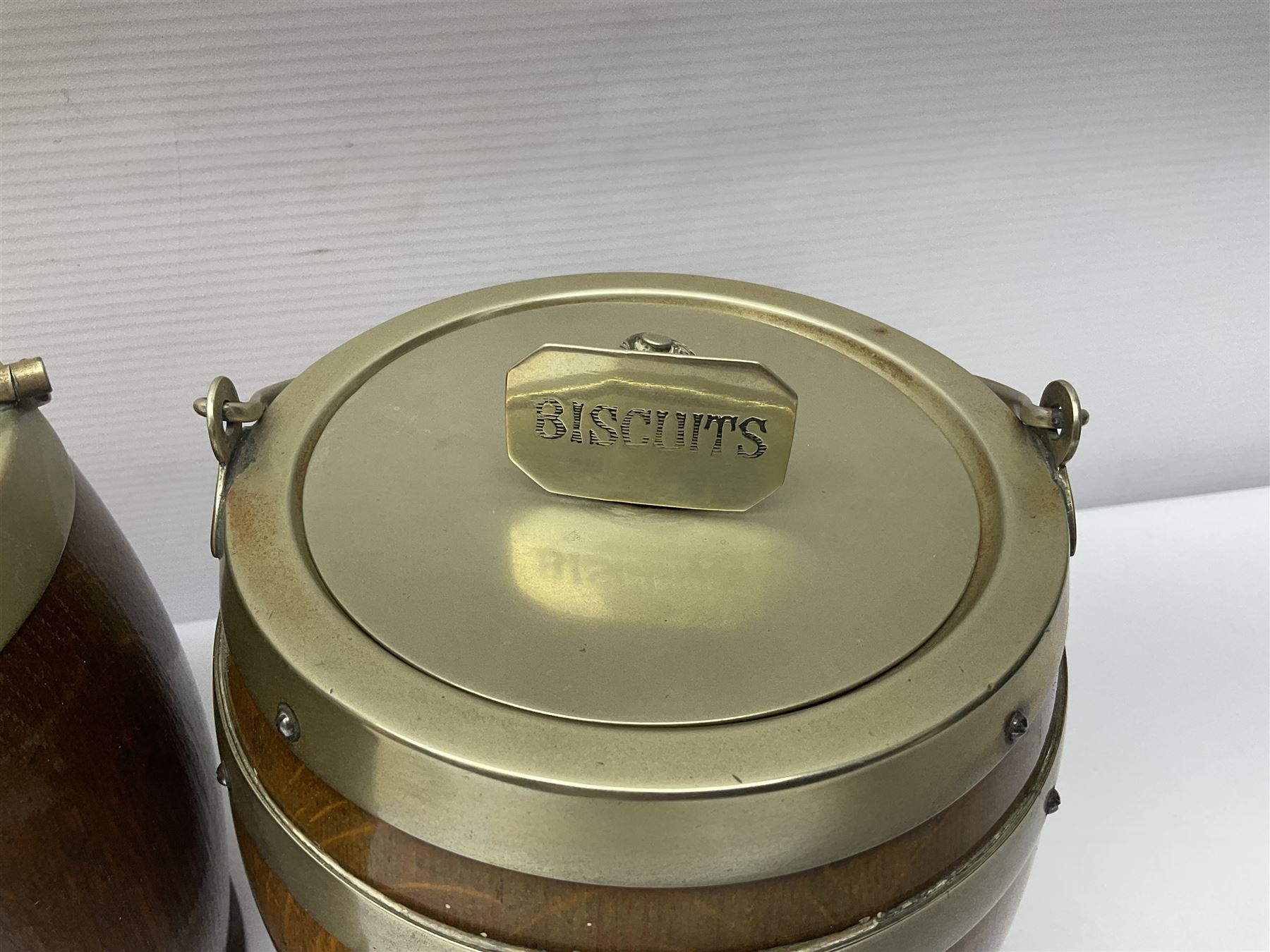 Five early 20th century biscuit barrels with silver-plated mounts, one made from Mahogany from HMS Hindustan