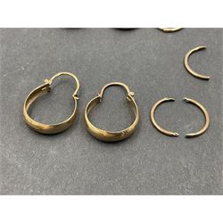 Two pairs of 9ct gold hoop earrings and 9ct gold earring oddments
