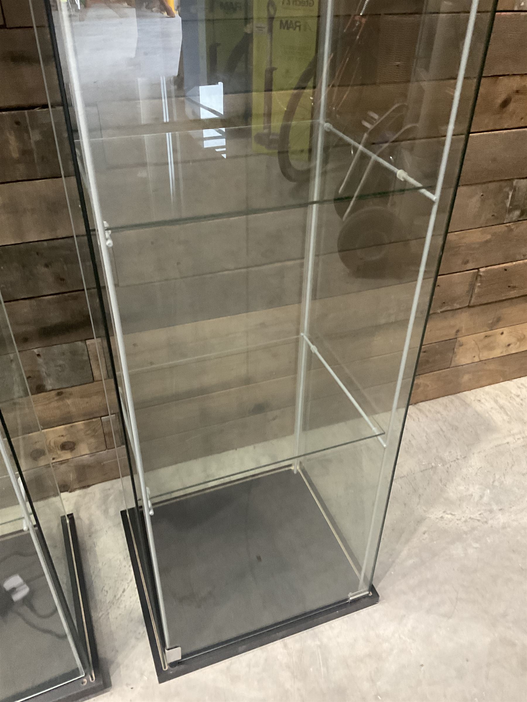 Three Ikea rosewood finish illuminated four glass shop display cabinets, with shelves and keys