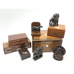  A 19th century walnut box, with mother of pearl cartouche and escutcheon, together with a further mother of pearl inlaid box, two other later wooden boxes, a Japanese lacquered box, Eastern carvings, etc.   