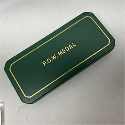 Two Imperial Service Medals to Elsie Hannah Ferguson and Fred Whitehead; each in original case; WWI Special Constabulary Medal to Inspr. Alfred W. Thompson; modern Prisoner of War Medal; cased; replica Victoria Cross and India Mutiny Medals with archive of information relating to Pte. Robert Newell V.C. 9th Lancers; replica Victoria Cross and George Cross with miniatures; and other replica medals etc