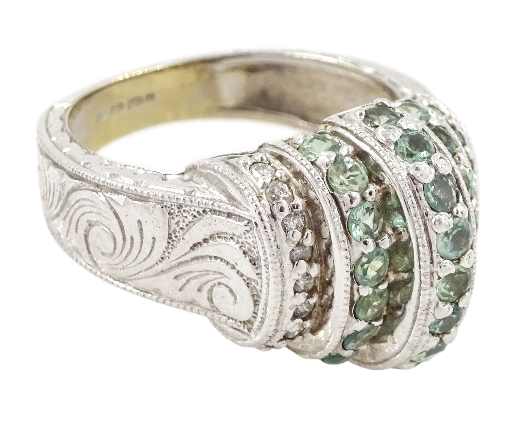 14ct white gold alexandrite and diamond stepped design ring, three rows of round cut alexandrite's, with a row of single cut diamonds either side, the shoulders with engraved foliate decoration, hallmarked