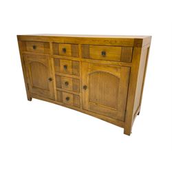 Oak sideboard, fitted with six drawers and two cupboards
