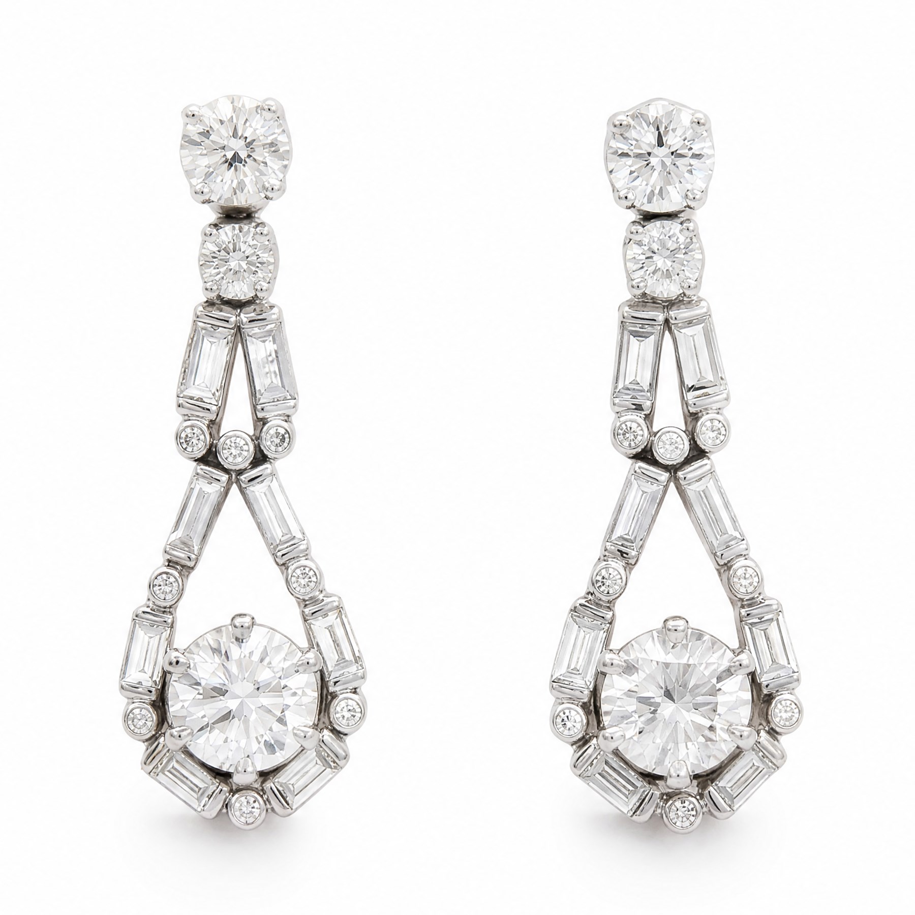 Pair of 18ct white gold diamond pendant earrings, each stud set with a round brilliant cut diamond of approx 0.60 each, surrounded by baguette and round cut diamonds, the tops with two further round brilliant cut diamonds, hallmarked, total diamond weight approx 2.00 carat