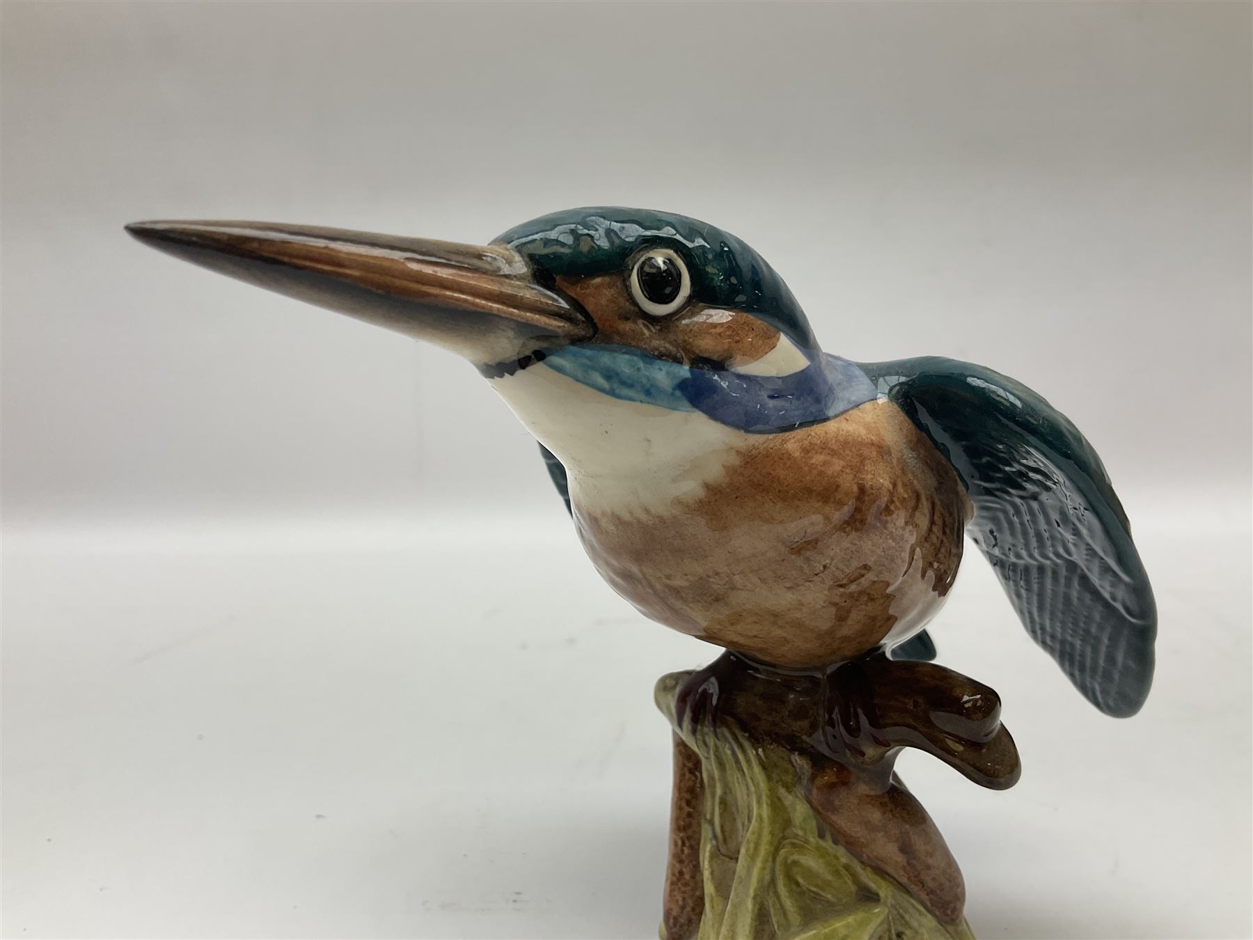 Karl Ens figure of a green woodpecker, modelled perched upon branch, model no. 7527, together with Karl Ens figure of budgie and Beswick Kingfisher no. 2371, all with printed marks beneath, tallest H25cm