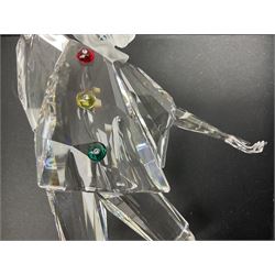 Swarovski Crystal Masquerade trilogy; 1999 Masquerade Pierrot, 2000 Columbine, 2001 Harlequin all with accompanying plaque, stand and original box, together with a glass display case with mirrored back and sides 