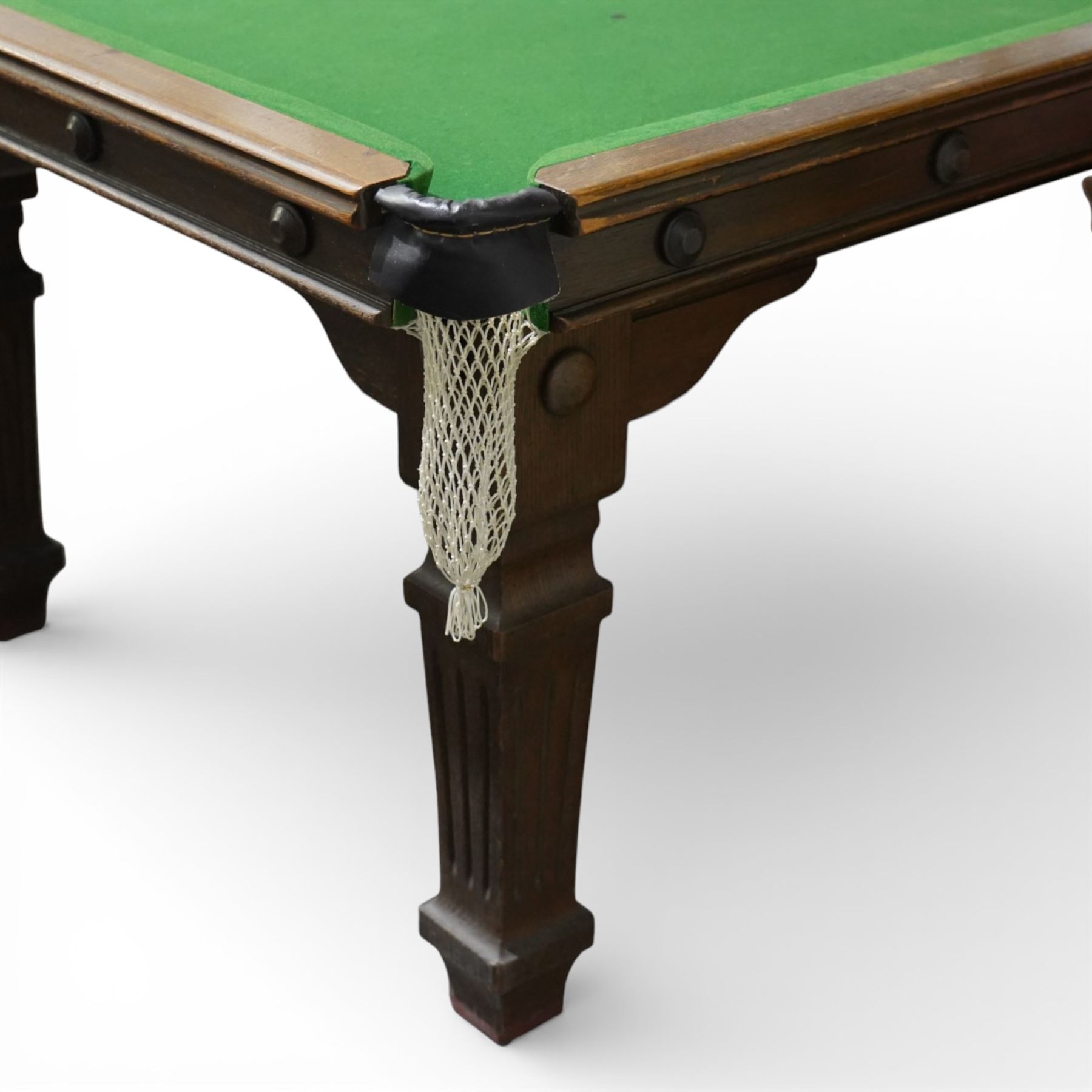 Riley - late 20th century Riley slate bed snooker table with dining table leaves, rectangular baize playing surface within a moulded hardwood frame with studded frieze rails and leather pocket mounts with net bags, raised on four square tapering fluted supports with block feet, with associated dining table leaves, with various cues, chalks, snooker and eight ball pools