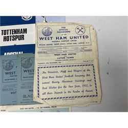 West Ham United - eight 1940s/50s home programmes for 1947/48 - 1951/52 and another for 1986/87 and two team photographs; together with eight Tottenham Hotspur home programmes 1952/53 - 1976/77 (17)