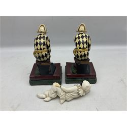 Pair of early-mid 20th century figural composite bookends modelled as harlequin court jesters sat upon stacks of books, H20cm together with a figure of a jester signed Vivian C (3)