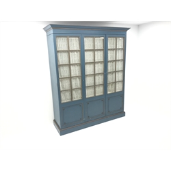  Large early 20th century triple wardrobe, projecting cornice, light royal blue and gilt painted finish, two glazed doors, plinth base, W174cm, H204cm, D55cm  