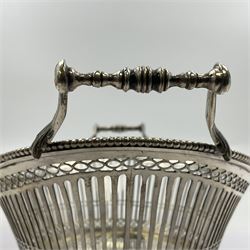 Early 20th century Dutch silver basket, of oval form with pierced sides, beaded rim, and twin handles, marked with Lion Passant for 2nd standard purity and date letter for 1910, other marks worn and indistinct, including handles H8.5cm L25.5cm