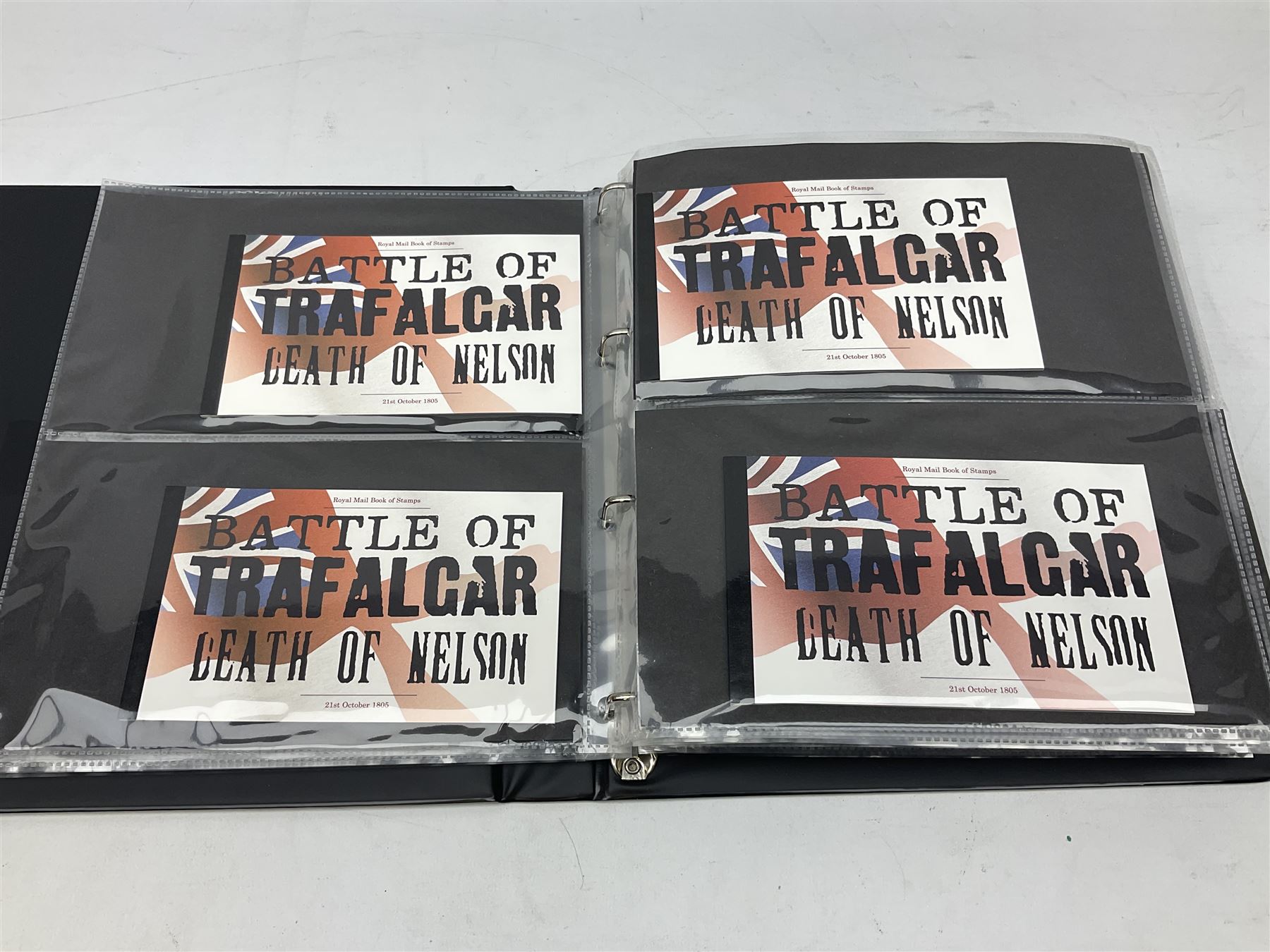 Seventy-five Royal Mail book of stamps, including 'The Story of Beatrix Potter', 'Microcosmos', 'Across The Universe', 'A Perfect Coronation', 'The Bronte Sisters', 'Battle of Trafalgar Death of Nelson' etc, housed in a ring binder album