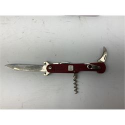Thirteen pocket knives including Swiss Army knives and other similar examples