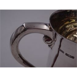 Modern silver tankard, of plain baluster form, with C scroll handle and personal engraving to body, upon stepped circular foot, hallmarked James Dixon & Sons Ltd, Sheffield 1975, H13.3cm, boxed 