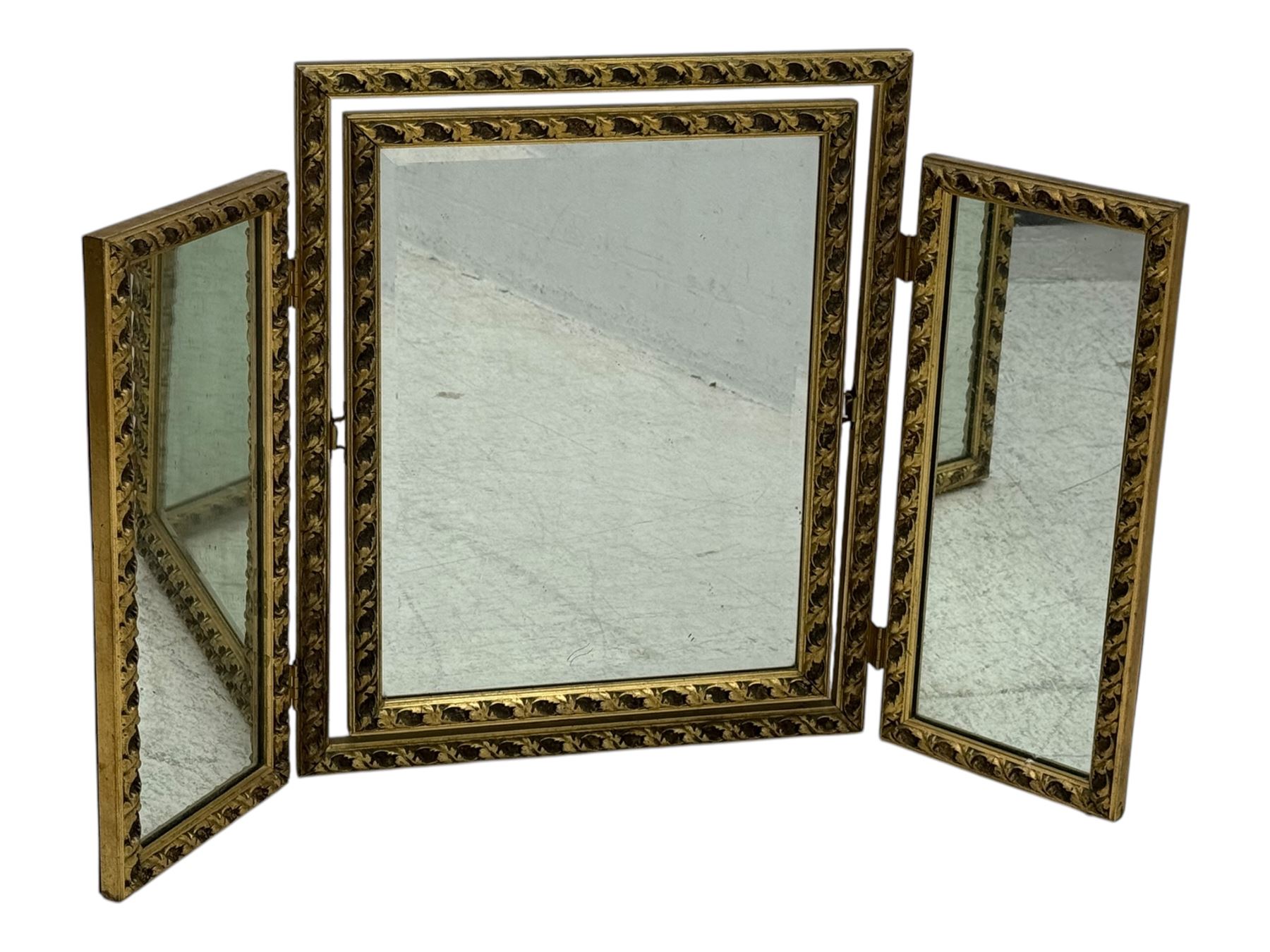 Four decorative mirrors, including gold-toned triptych dressing mirror with foliate borders, two rectangular framed mirrors and a circular gilt mirror with ornate edging