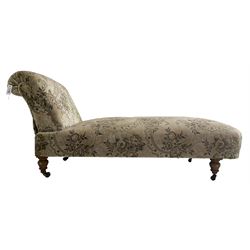Victorian walnut and hardwood framed chaise longue, drop-back on staggered mechanism, upholstered in floral design fabric, turned feet on castors 