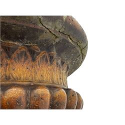 Victorian salt glazed terracotta garden urn on plinth, the Campana shaped urn with foliate decoration over gadrooned underbelly, the plinth of square tapering form, each side with recessed moulded archway decorated with urn cartouches, stepped and moulded skirt base