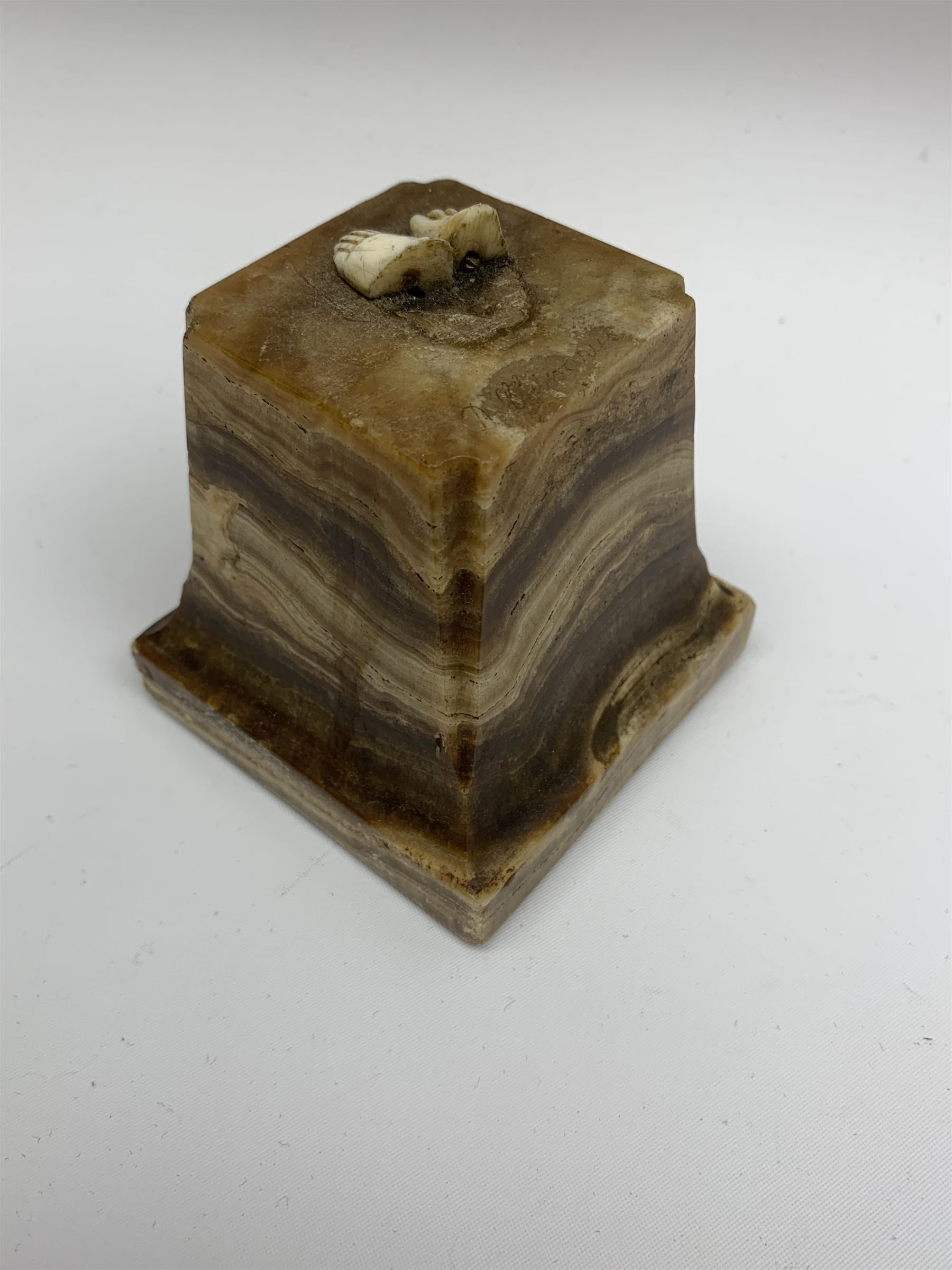 Demetre Chiparus (1886-1947): Innocence, a gilt bronze and ivory figure, circa 1925, standing in contemplative post with hands clasped, upon onyx plinth, signed to base, H24.4cm