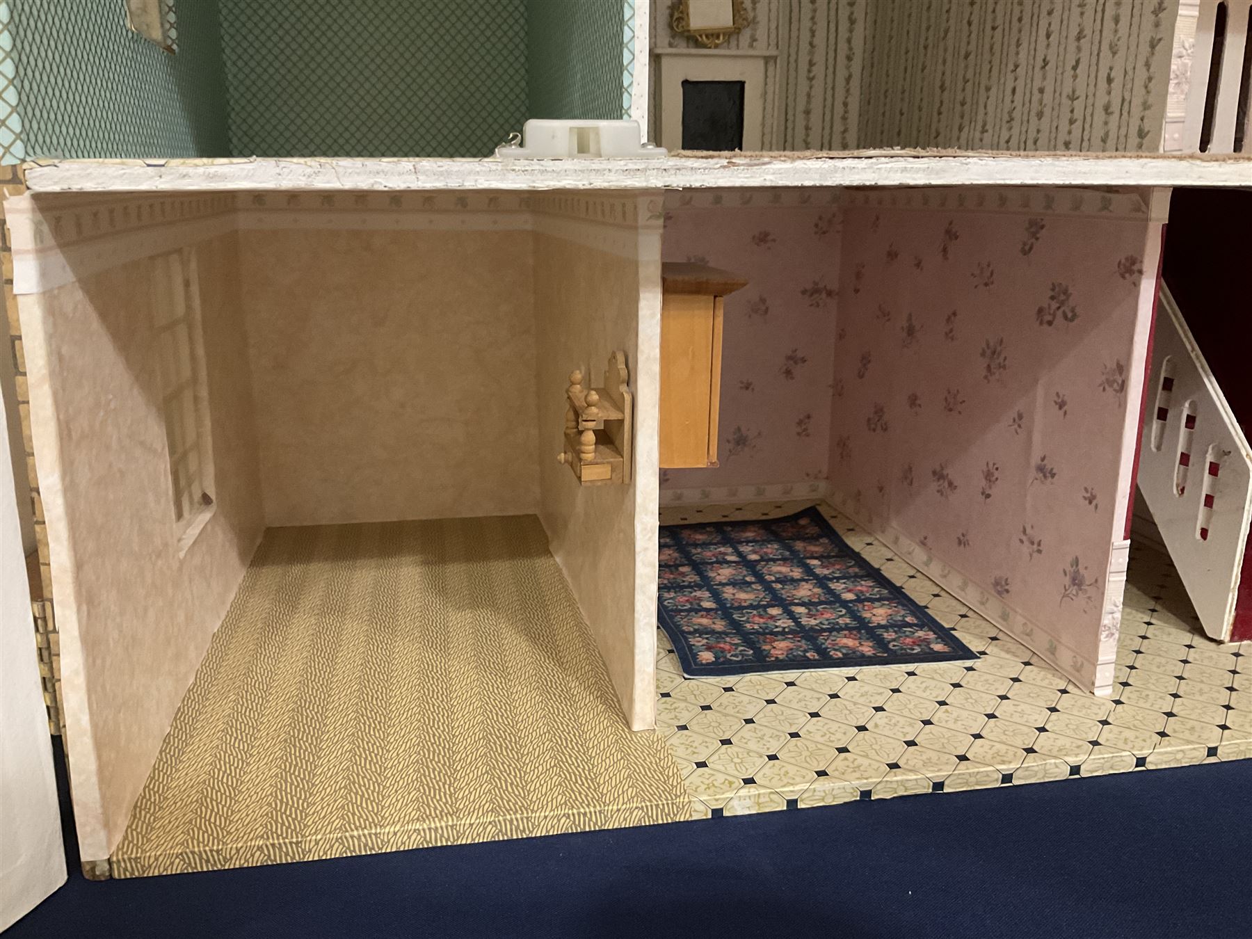 Modern scratch-built Palladian style wooden dolls  house as a 19th century double fronted two-storey property with simulated brick and stone walls under a removable simulated slate hipped roof; the triple hinged front elevation opening to reveal six rooms with central hall, stairs and landing L94cm H56cm D40cm