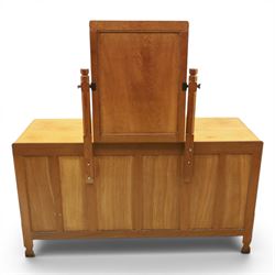 Mouseman - adzed oak kneehole dressing table with mirror, the rectangular adzed top with raised back and canted corners with fixed central pivoting mirror with scallop-carved cresting rail, over an arched recessed kneehole flanked by three graduating drawers to each side with turned knob handles, raised on octagonal feet, with carved mouse signature, by the workshop of Robert Thompson of Kilburn