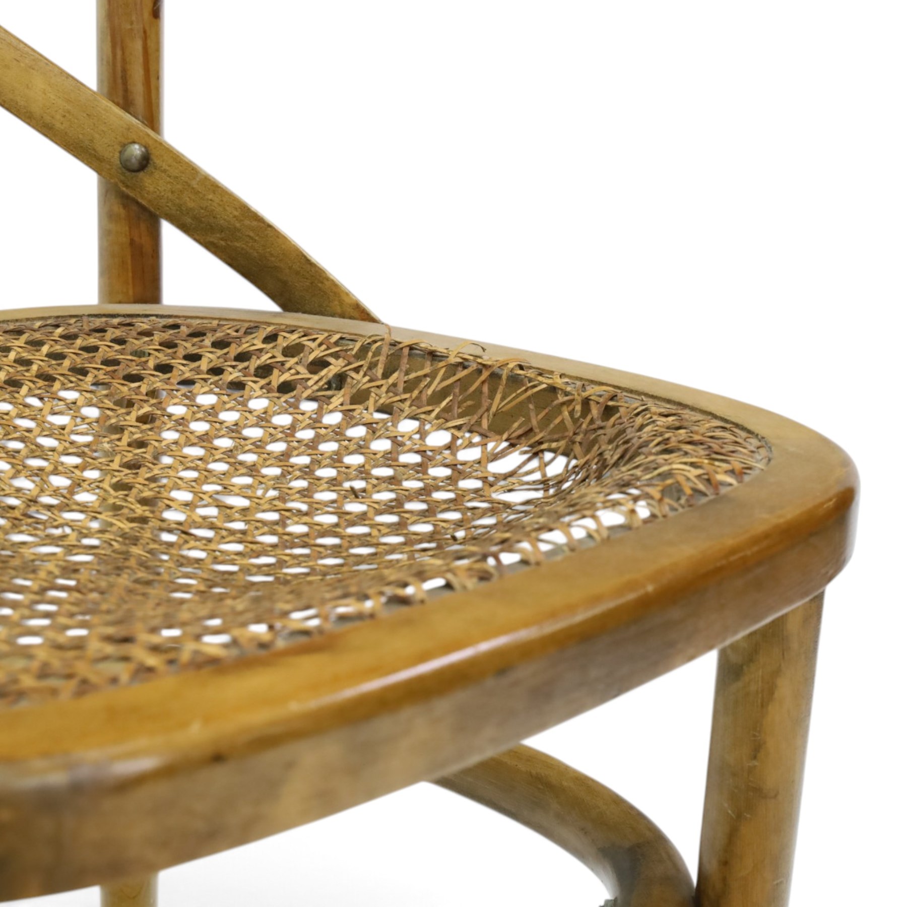 Set of four Oka style rattan dining chairs, bentwood frames inset rattan seat