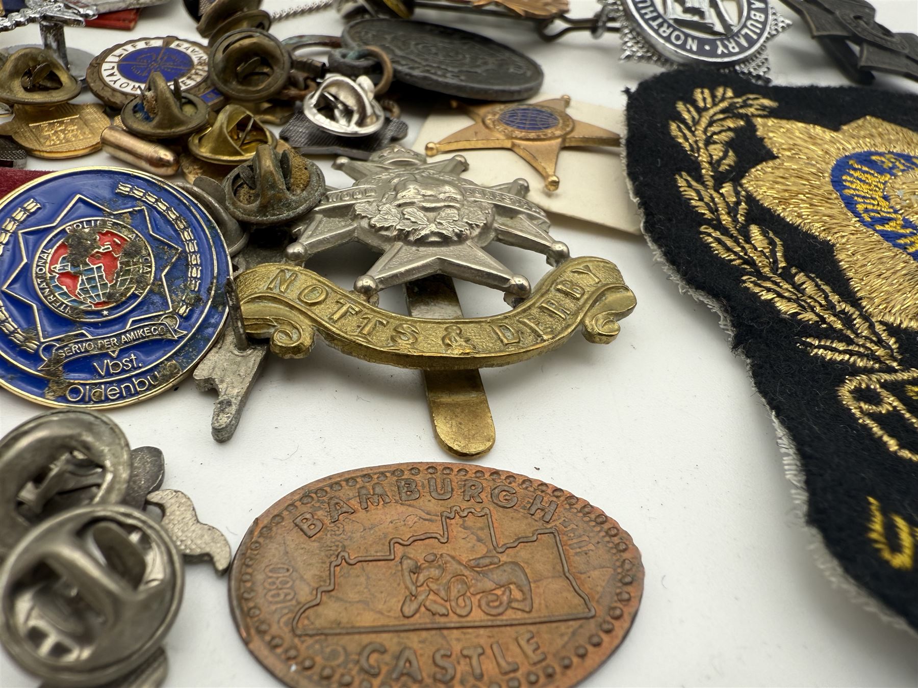 Collection of military and similar enamel badges, pin badges, cloth badges and brasses