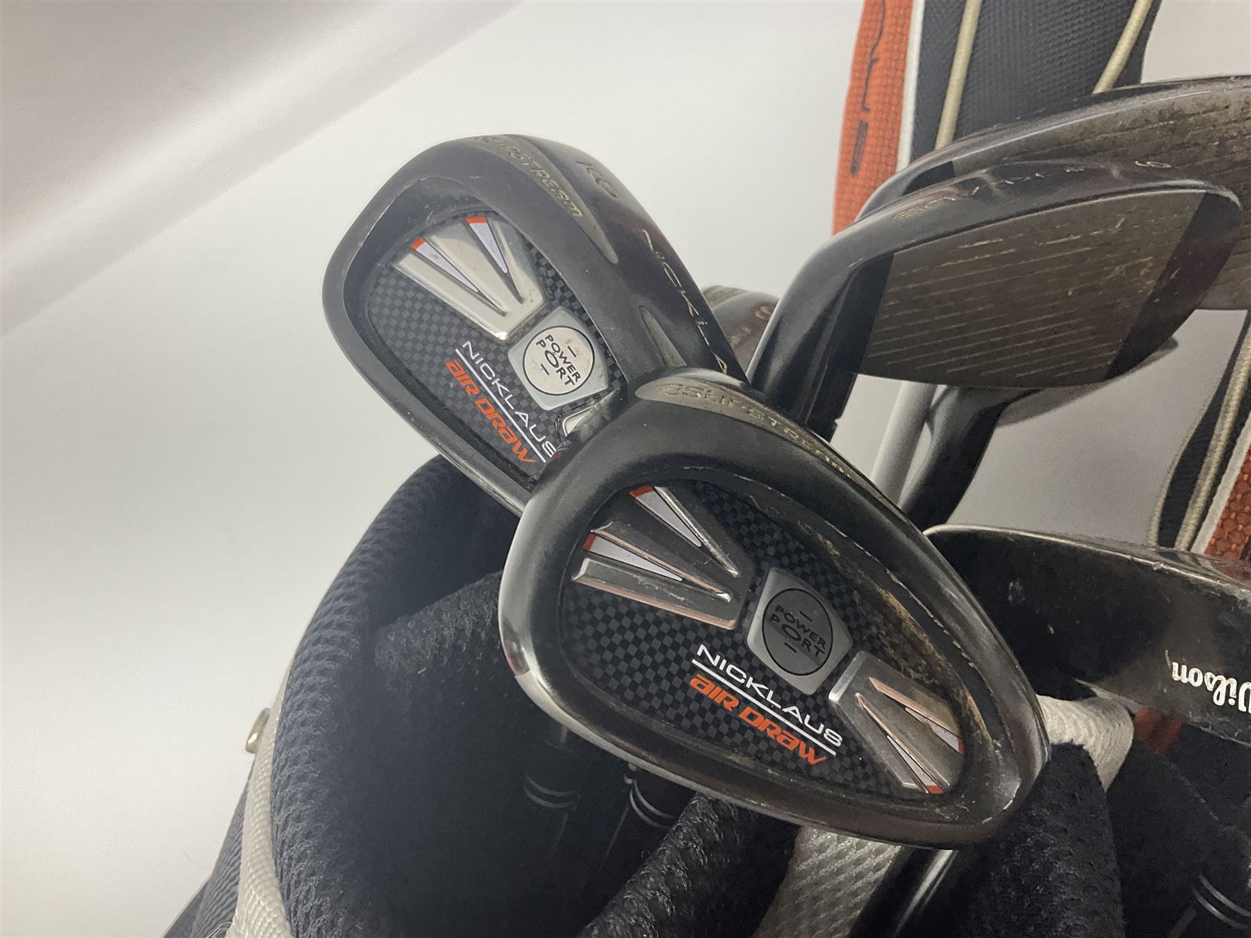 Set of eighteen golf clubs, including drivers, putters etc, together with Nicklaus golf bag