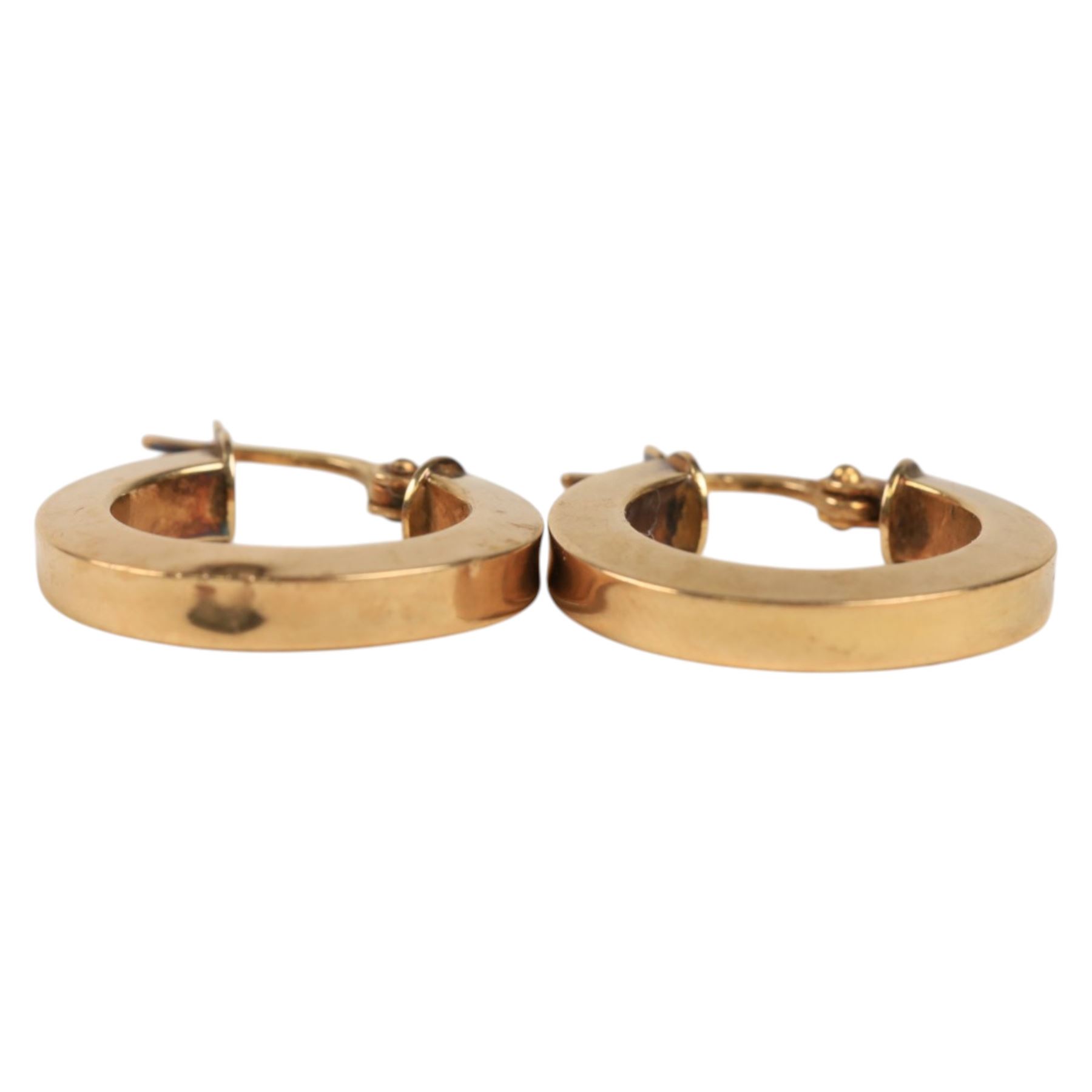 Two pairs of 9ct gold hoop earrings and a pair of 9ct gold knot earrings