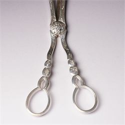 Pair of Victorian silver grape scissors with engraved decoration Birmingham 1860 Maker probably John Gilbert and a small silver sauce boat with crimped rim and C scroll handle Birmingham 1905 Maker Thomas Hayes (2)  