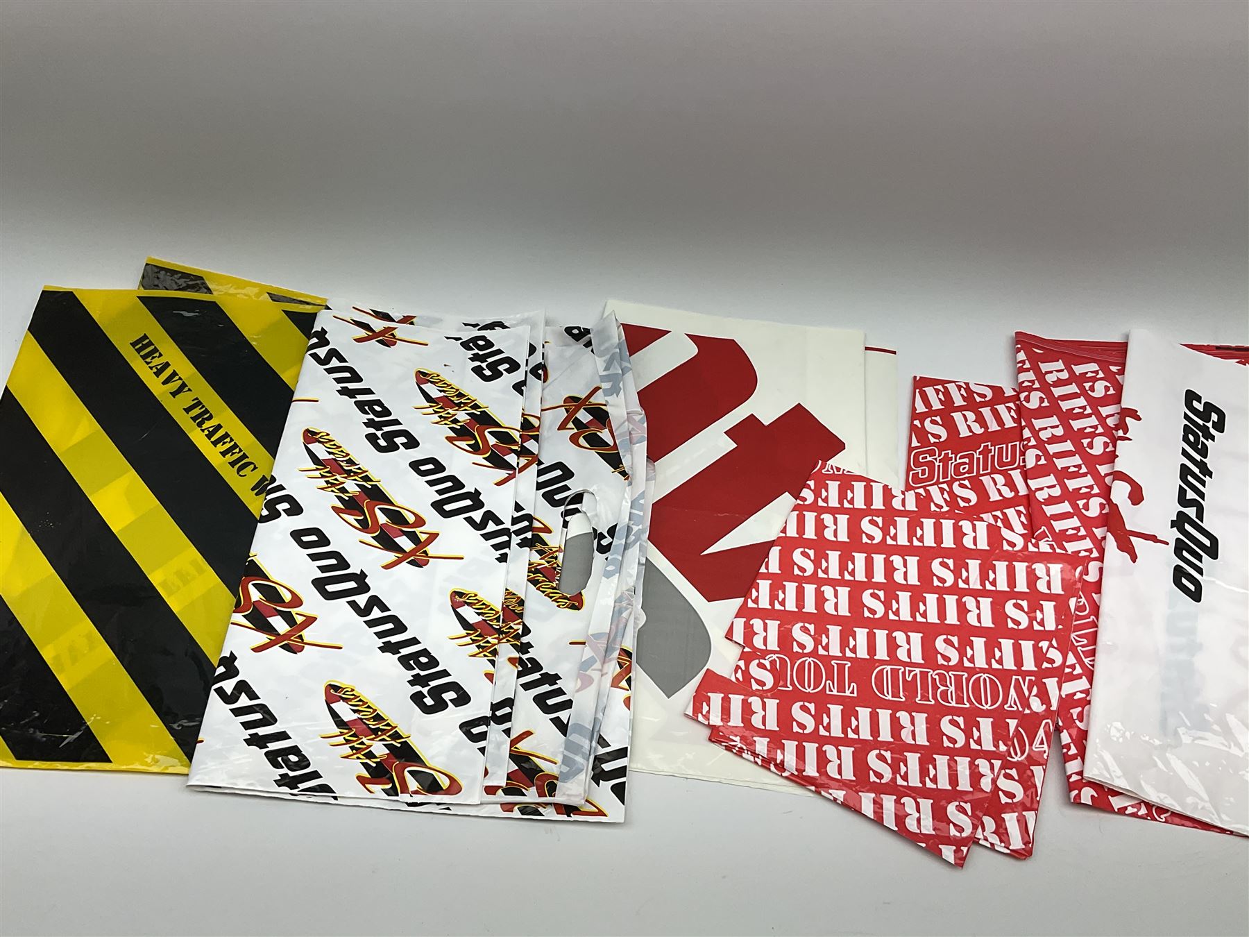 Status Quo: The Official 40th Anniversary Limited Edition book No.926/3000 with certificate signed by Rossi and Parfitt. Duplicate signatures by Rossi and Parfitt on pages within the book. Denim dustjacket; 'From The Makers Of ....' boxed set of three LP records in circular blue tin; and quantity of tour carrier bags