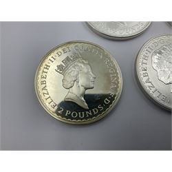 Five Queen Elizabeth II United Kingdom one ounce fine silver Britannia two pound coins dated 1997, 1998, 1999, 2000 and 2001 