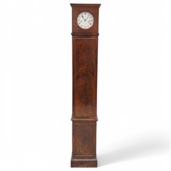John Hill of Covent Garden, London- Slim Regency 8-day mahogany longcase clock c1820, plain case with a flat top and cornice, square door to the dial with a circular glazed aperture, rectangular trunk with a long door and moulding beneath, raised panel and applied skirting, silvered sheet dial with Roman numerals, spade hands and makers name, weight driven rack striking movement with a recoil anchor escapement, striking the hours on a bell. With weights and pendulum.
John Hill is recorded as working at Covent Garden for a relatively short period 1820-24.


