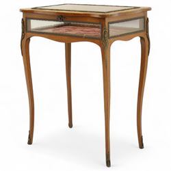 Louis XV revival style walnut bijouterie table, rectangular serpentine form, with brass edging and a hinged floral marquetry inlaid lid with bevelled glass top and sides, gilt-bronze beaded border, interior lined with rich red velvet, raised on slender cabriole legs with gilt bronze masks and sabots, circa 1900