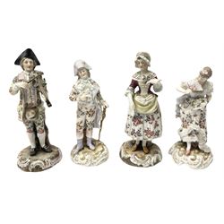 Four 20th century continental figures, comprising woman in period dress with lace detail holding a fan, man in formal dress with lace detail, leaning on a stick, a man playing the violin and a woman holding a letter, all on scrolled bases with gilt detail, tallest example H16cm