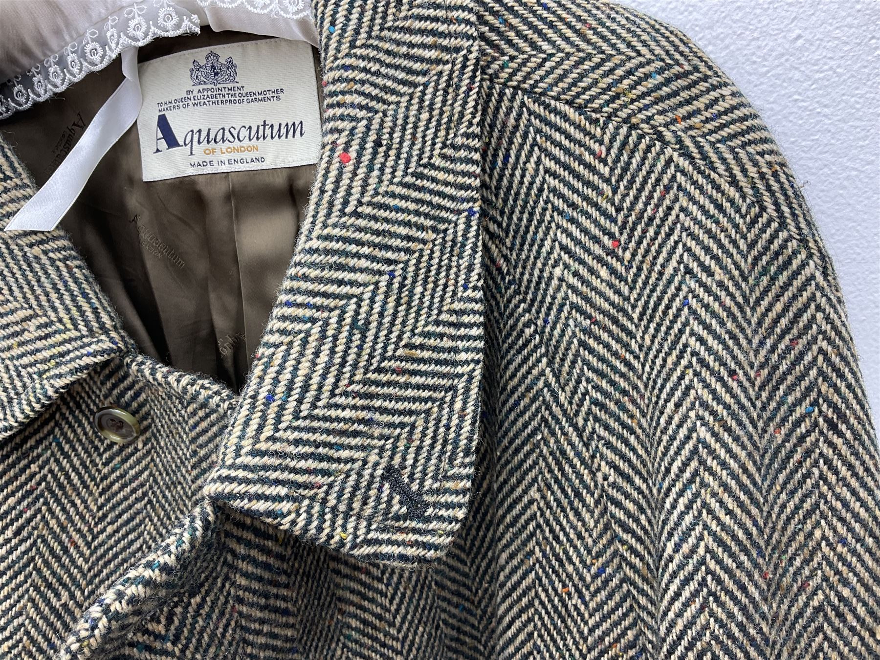 Men's Aquascutum lambs wool herringbone tweed coat with silk lining, 46 Reg, together with a further Men's Aquascutum grey wool duffle coat, with cheque lining and horn buttons, 46