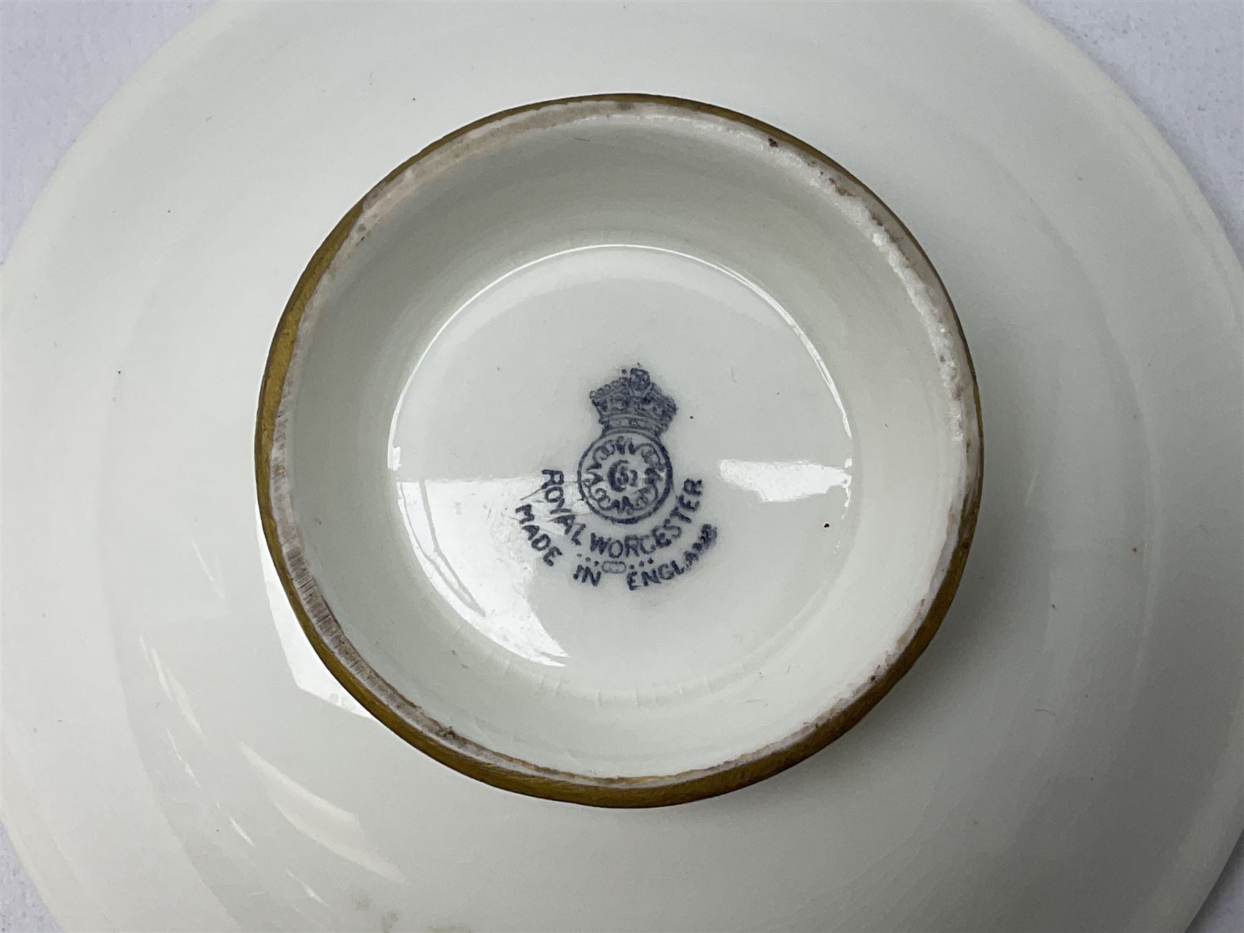 1938 Royal Worcester circular pedestal pin dish, decorated with pheasants in a landscape by James Stinton, with printed mark beneath, D10.5cm