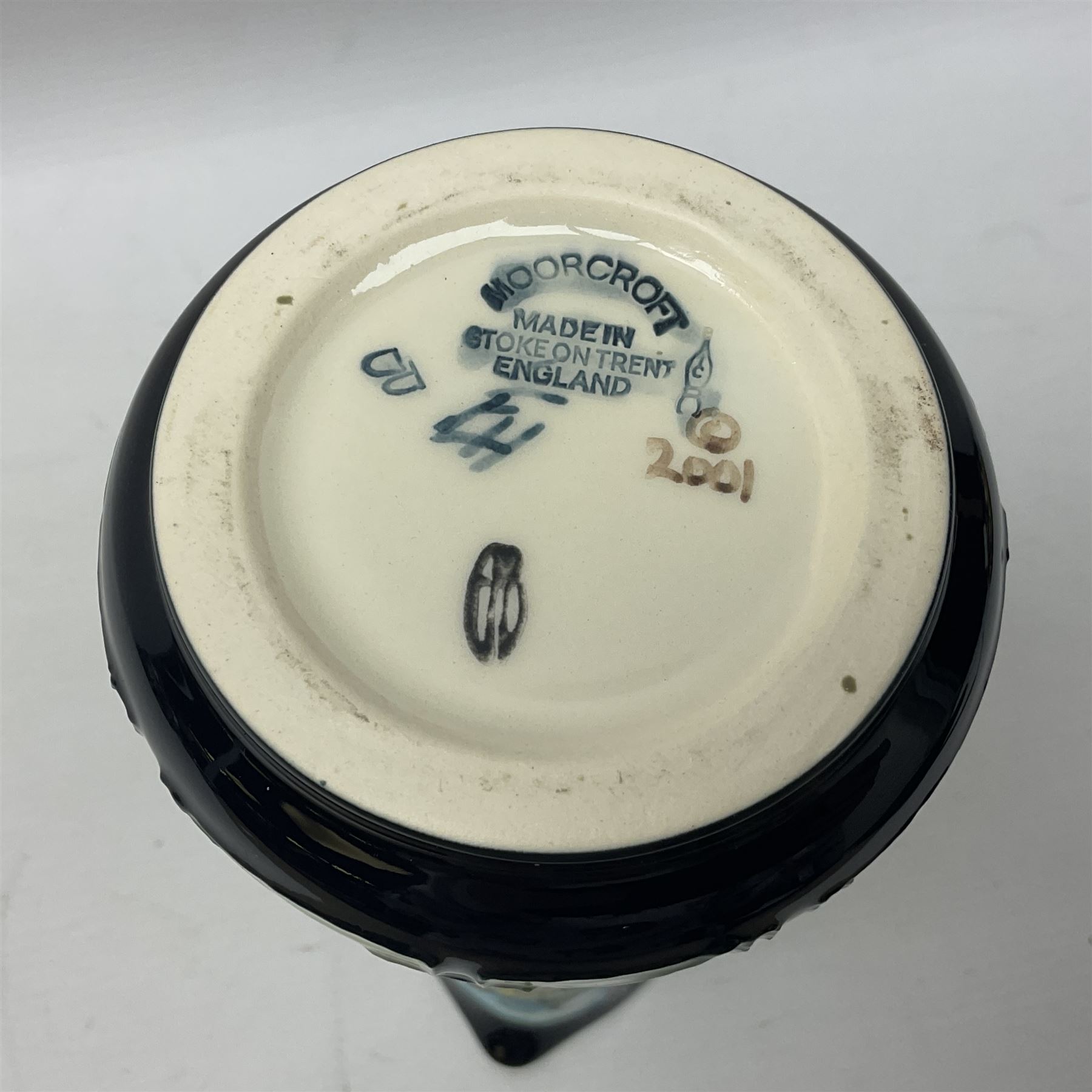 Moorcroft jug, of tapering form, decorated in the Calla Lily pattern by Emma Bossons, circa 2001, H24cm