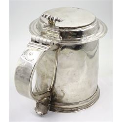 Queen Anne silver tankard, of plain tapering cylindrical form, with stepped and flat-domed cover, twit cast thumbpiece and curved handle, the body engraved with eagle crest, hallmarked Abraham Barachin, Hull, circa 1706, the body and cover stamped once with makers mark and twice with town mark, H18cm, approximate weight 21.46 ozt (667.7 grams)
