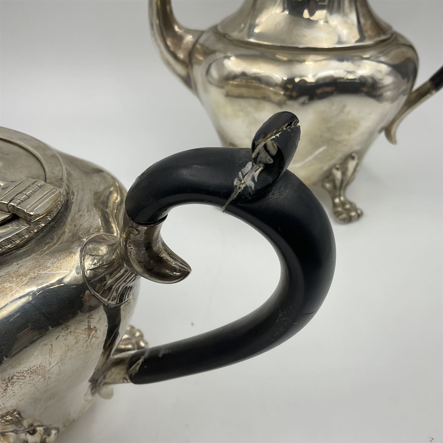 Five piece Edwardian silver tea service, comprising teapot and coffee pot, each with ebonised scroll handle, tea caddy with hinged cover, twin handled open sucrier, and milk jug, each of rounded bombe form, upon four paw feet, hallmarked William Adams Ltd, Birmingham 1904 and 1905, coffee pot H26cm
