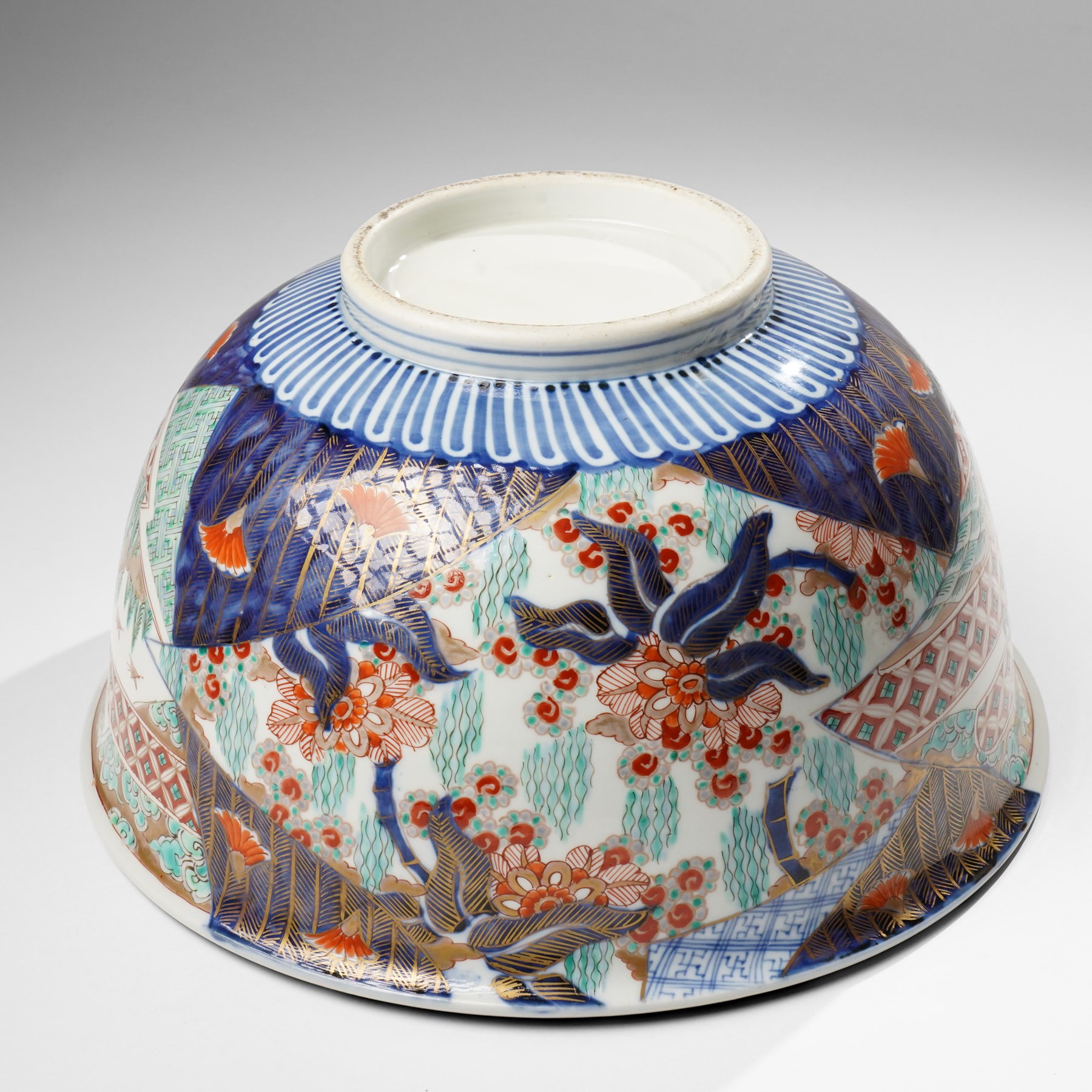 Japanese 19th century Imari bowl, painted profusely internally and externally with landscapes, flowers and traditional motifs, H16.5cm 