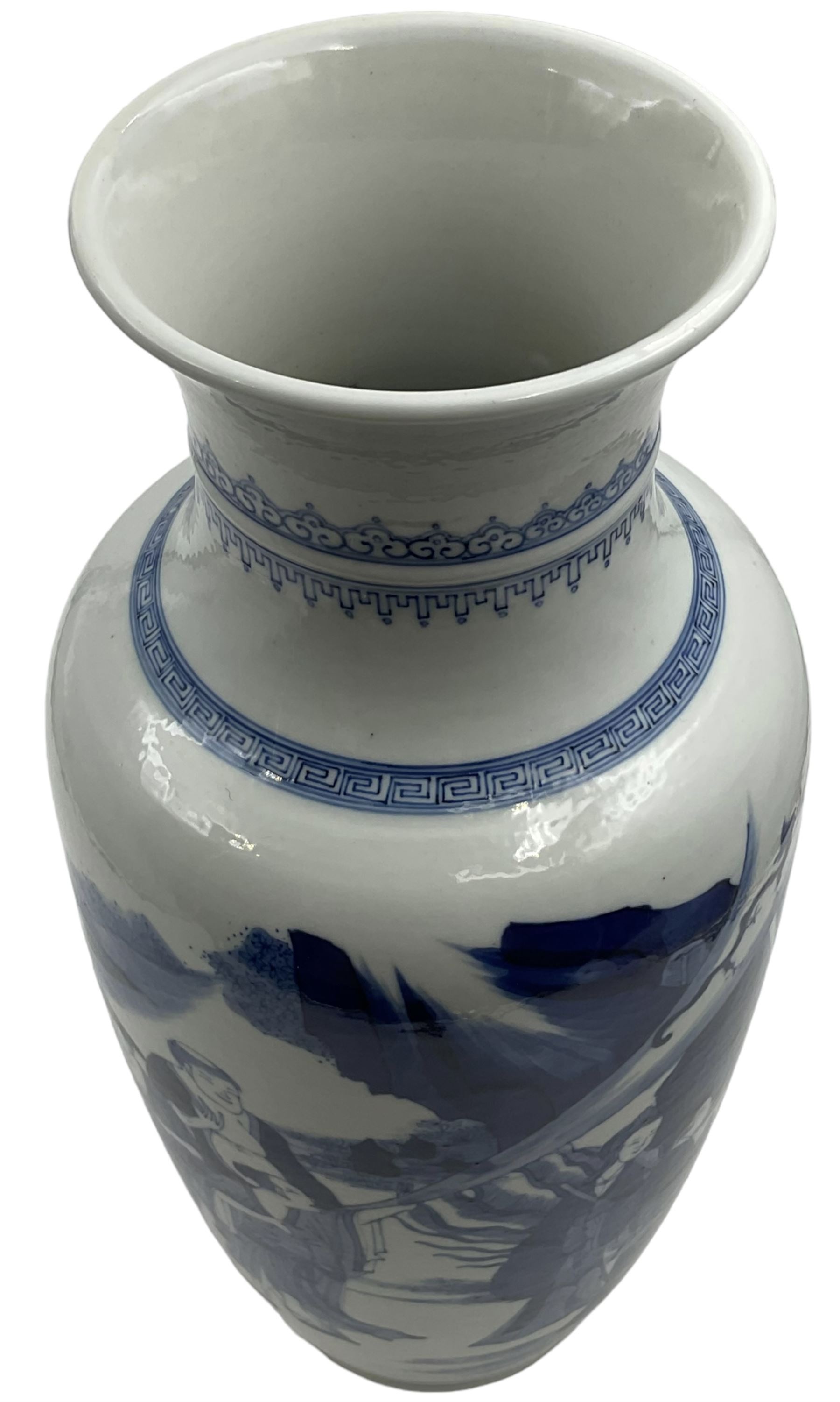 A Chinese blue and white Qing dynasty style vase, painted in underglaze blue with figures in a rocky landscape, six character Kangxi type mark to base, H34cm