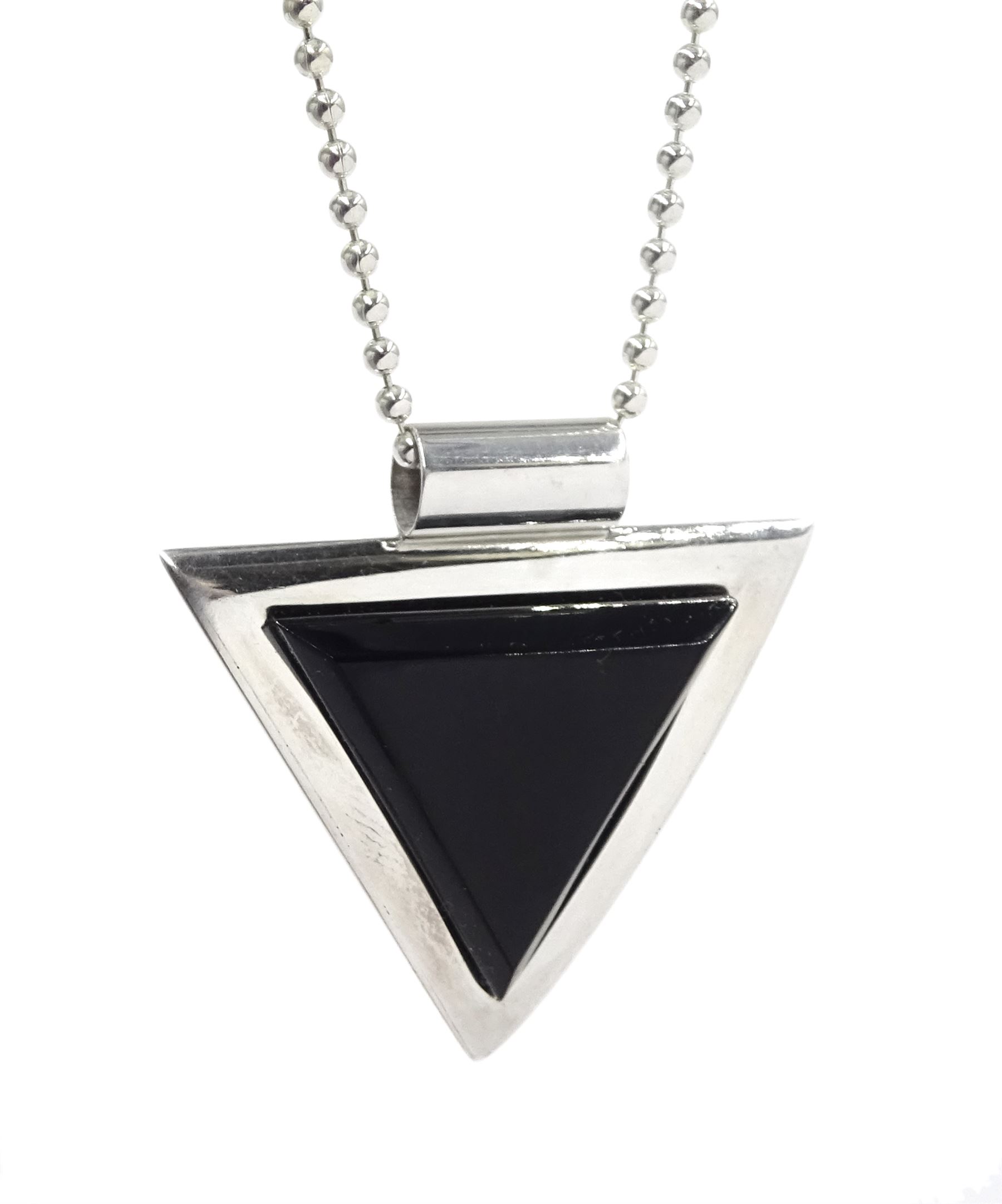 Silver contemporary triangular Whitby jet pendant necklace, two other silver Whitby jet necklaces; one round and one in a paisley shape, and two pairs of Whitby jet earrings; matching paisley shape and the other pair cushion triangle shaped, all stamped 925
