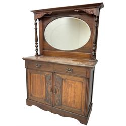 Victorian carved walnut mirror-back chiffonier, raised back with bevelled oval plate and turned pilasters, fitted with two drawers over double cupboard, on skirted base