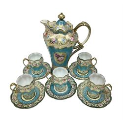 Noritake coffee service, hand painted with roses and gilt detail on a blue ground, comrosing coffee pot, five cups and saucers