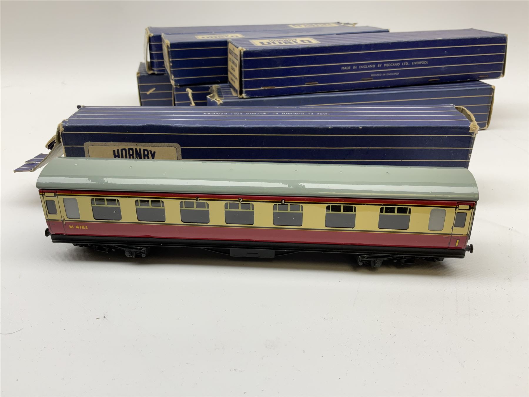Hornby Dublo - eight coaches comprising D12 First L.M.S.; 32018 D12 Corridor Coach B.R. Brake/3rd (L.M.R.); 32090 D13 Suburban Coach First/Third B.R.; 32093 D14 Suburban Coach Brake/Third B.R.; 32096 D20 Composite Restaurant Car (Western Region); two 32094 D21 Corridor Coach B.R. First/2nd (W.R.); and 32023 D22 Corridor Coach B.R. Brake/2nd (M.R.); all in boxes (8)